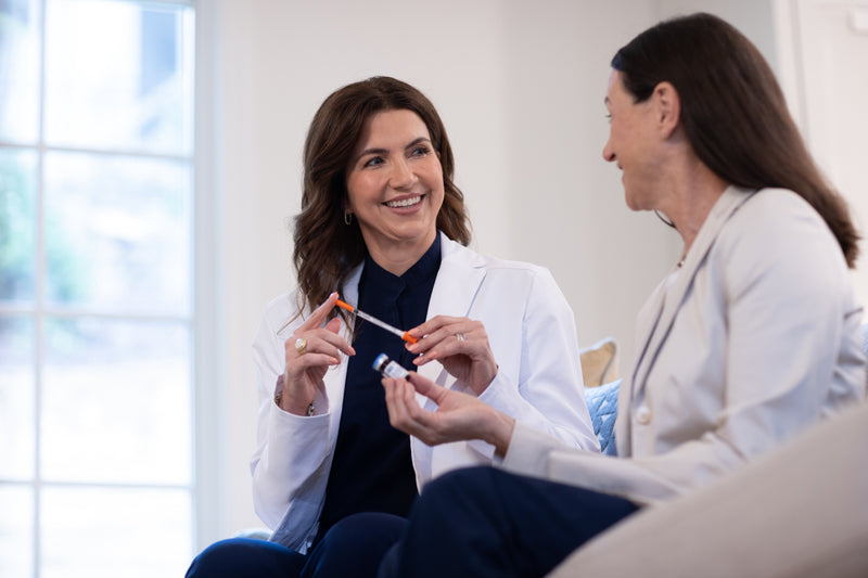 Pharmacist consulting with a patient about GLP-1 injectable medication