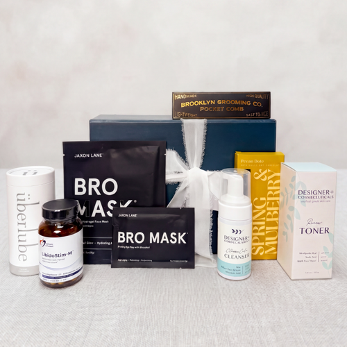 Father's Day collection of skincare and grooming products on a light gray surface with a neutral background
