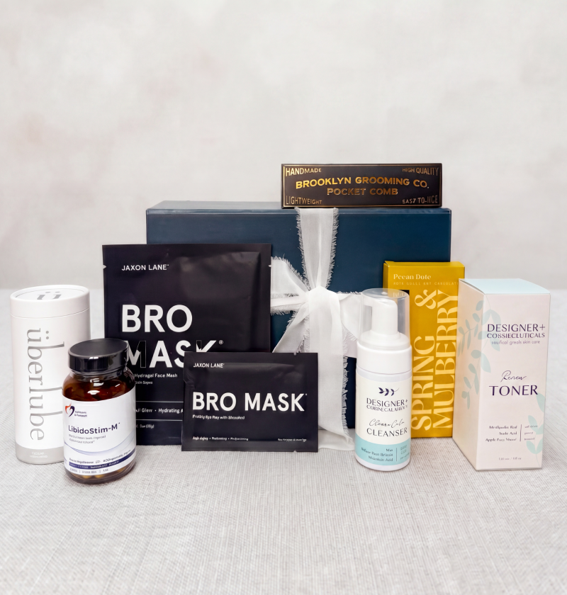 Father's Day collection of skincare and grooming products on a light gray surface with a neutral background