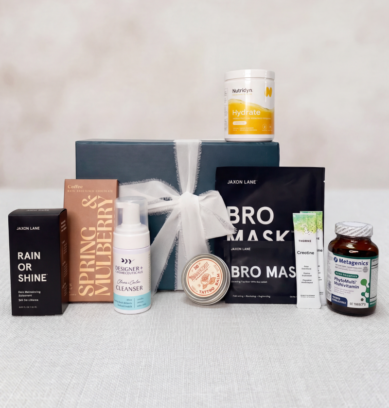 Father's Day collection of skincare and wellness products on a light gray surface with a neutral background.